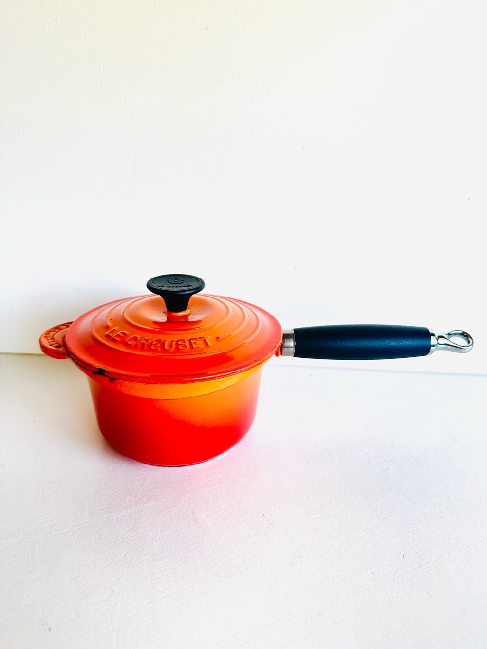 LE CREUSET Flame Orange 16cm Enamel Saucepan and Lid with Black Phenolic handle